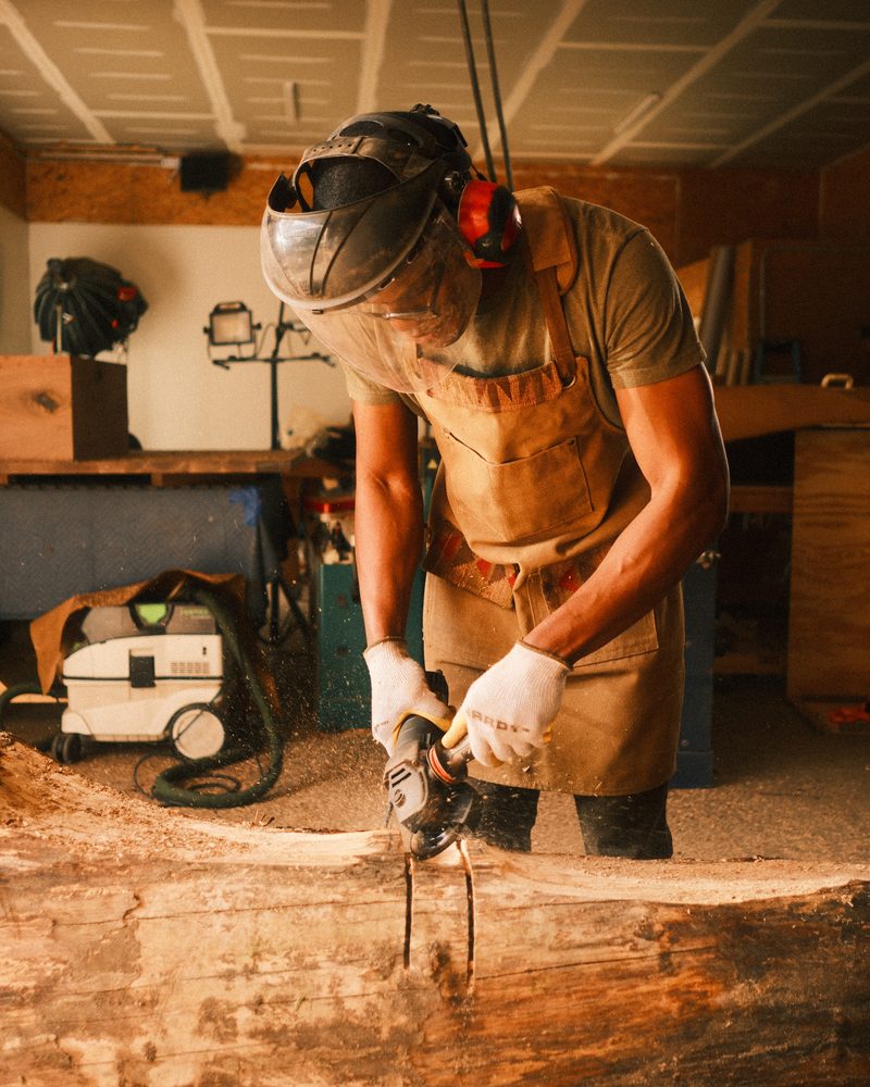 Kwadwo Som-Pimpong shaping salvaged timber