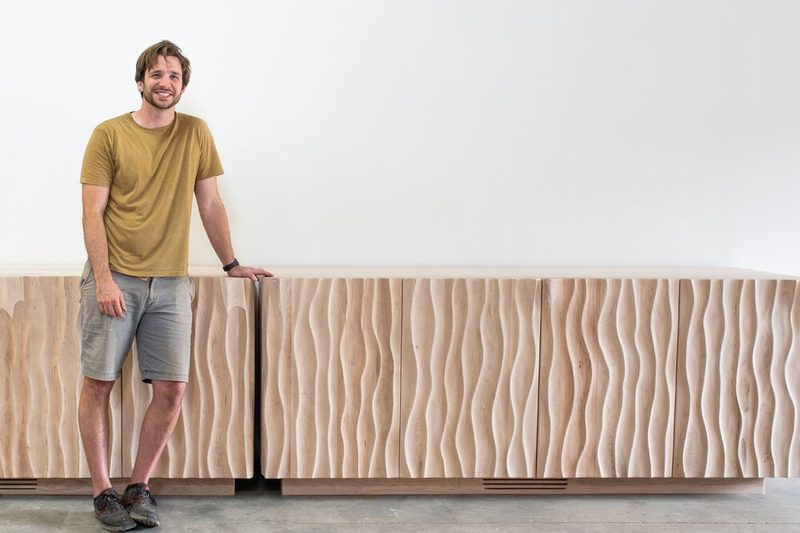 Mark Oliver with carved furniture
