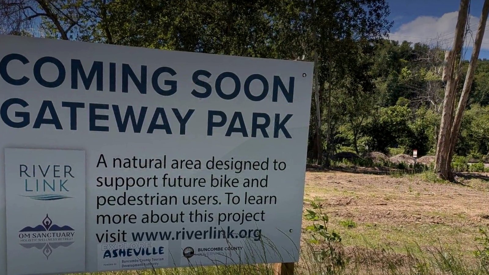Coming Soon Gateway Park sign from RiverLink beside the future park site on Riverside Drive