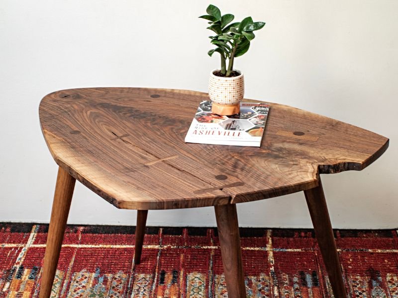 Live-edge walnut side table with tapered legs